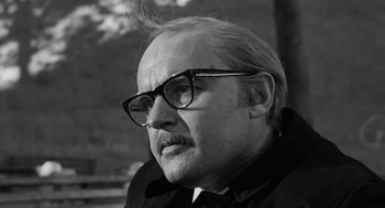 Movie still from “The Pawnbroker” (1964), directed by Sidney Lumet – An older man wearing glasses looking at the camera; Close Up shot, Low angle