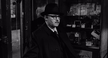 Movie still from “The Pawnbroker” (1964), directed by Sidney Lumet – A man wearing a hat and a coat; Close Up shot, Over the shoulder angle
