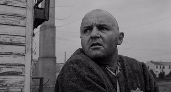 Movie still from “The Pawnbroker” (1964), directed by Sidney Lumet – A bald man with a towel around his neck; Close Up shot, Low angle