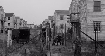 Movie still from “The Pawnbroker” (1964), directed by Sidney Lumet – A black and white photo of men working in a field; Wide shot, High angle