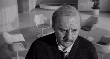 Movie still from “The Pawnbroker” (1964), directed by Sidney Lumet – An older man wearing glasses and a tie; Close Up shot, Over the shoulder angle