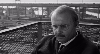 Movie still from “The Pawnbroker” (1964), directed by Sidney Lumet – An older man wearing glasses and a tie; Close Up shot, Low angle