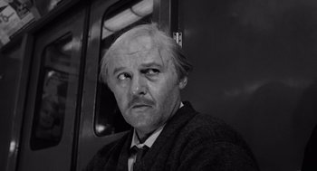 Movie still from “The Pawnbroker” (1964), directed by Sidney Lumet – A black and white photo of a man in a suit and tie; Close Up shot, Low angle