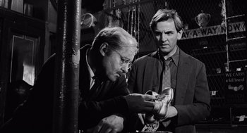 Movie still from “The Pawnbroker” (1964), directed by Sidney Lumet – Two men are looking at a pair of shoes; Close Up shot, Low angle