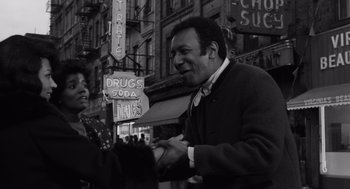 Movie still from “The Pawnbroker” (1964), directed by Sidney Lumet – A black and white photo of a man and a woman; Medium shot, Low angle