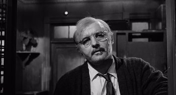 Movie still from “The Pawnbroker” (1964), directed by Sidney Lumet – An older man wearing glasses and a tie; Close Up shot, Low angle