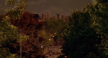 Movie still from “The Perfect Man” (2005), directed by Mark Rosman – A view of a city at night from a distance; Extreme Wide shot, High angle