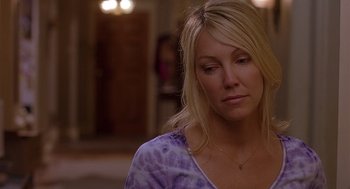 Movie still from “The Perfect Man” (2005), directed by Mark Rosman – A woman with blonde hair wearing a purple shirt; Close Up shot, Over the shoulder angle