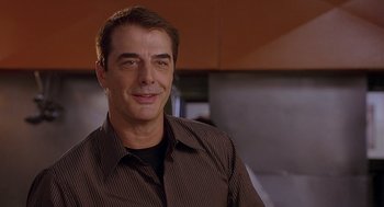 Movie still from “The Perfect Man” (2005), directed by Mark Rosman – A person wearing a brown shirt; Close Up shot, Over the shoulder angle