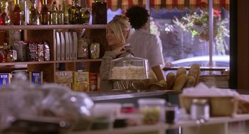 Movie still from “The Perfect Man” (2005), directed by Mark Rosman – A woman behind a counter in a store; Medium shot, Over the shoulder angle