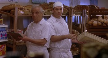Movie still from “The Perfect Man” (2005), directed by Mark Rosman – Two men in white aprons standing next to each other in a bakery; Medium shot, Low angle