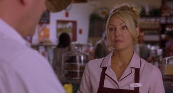 Movie still from “The Perfect Man” (2005), directed by Mark Rosman – A woman standing in front of a man in a restaurant; Close Up shot, Over the shoulder angle