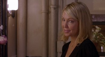 Movie still from “The Perfect Man” (2005), directed by Mark Rosman – A woman with blonde hair wearing a black jacket; Close Up shot, Over the shoulder angle