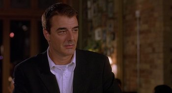 Movie still from “The Perfect Man” (2005), directed by Mark Rosman – A person wearing a suit and tie; Close Up shot, Over the shoulder angle