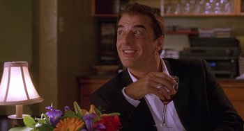 Movie still from “The Perfect Man” (2005), directed by Mark Rosman – A person holding a glass of wine; Close Up shot, Over the shoulder angle