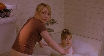 Movie still from “The Perfect Man” (2005), directed by Mark Rosman – A woman and a child in a bath tub; Medium shot, Over the shoulder angle