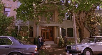 Movie still from “The Perfect Man” (2005), directed by Mark Rosman – A group of people standing in front of a building; Extreme Wide shot, Low angle