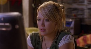 Movie still from “The Perfect Man” (2005), directed by Mark Rosman – A person sitting down looking at the camera; Close Up shot, Over the shoulder angle