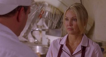 Movie still from “The Perfect Man” (2005), directed by Mark Rosman – A woman standing in front of a man in a kitchen; Close Up shot, Over the shoulder angle