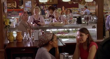 Movie still from “The Perfect Man” (2005), directed by Mark Rosman – A group of women sitting at a counter in a restaurant; Medium shot, Over the shoulder angle