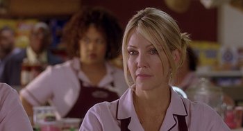 Movie still from “The Perfect Man” (2005), directed by Mark Rosman – A woman in a white shirt is looking to her left; Close Up shot, Over the shoulder angle