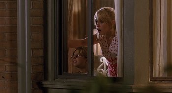 Movie still from “The Perfect Man” (2005), directed by Mark Rosman – A woman and a boy looking out a window; Medium shot, Over the shoulder angle