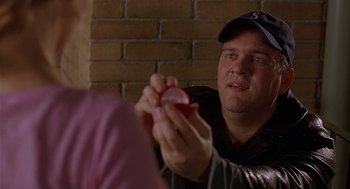 Movie still from “The Perfect Man” (2005), directed by Mark Rosman – A man holding an object in his hand; Close Up shot, Over the shoulder angle