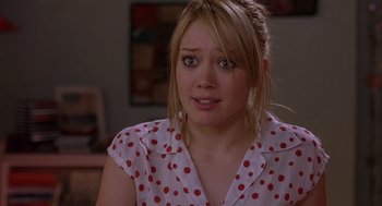 Movie still from “The Perfect Man” (2005), directed by Mark Rosman – A person wearing a polka dot shirt; Close Up shot, Over the shoulder angle