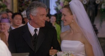 Movie still from “The Perfect Man” (2005), directed by Mark Rosman – A man and a woman are smiling at each other; Close Up shot, Low angle