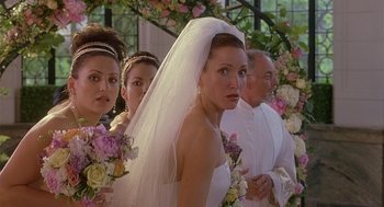 Movie still from “The Perfect Man” (2005), directed by Mark Rosman – A group of people standing in front of flowers; Close Up shot, Over the shoulder angle