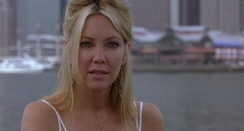Movie still from “The Perfect Man” (2005), directed by Mark Rosman – A woman with blonde hair wearing a white top; Close Up shot, Over the shoulder angle