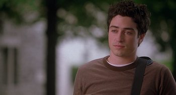 Movie still from “The Perfect Man” (2005), directed by Mark Rosman – A person wearing a brown and white shirt; Close Up shot, Over the shoulder angle