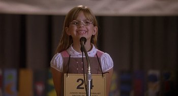 Movie still from “The Perfect Man” (2005), directed by Mark Rosman – A young girl standing in front of a microphone; Medium shot, Low angle