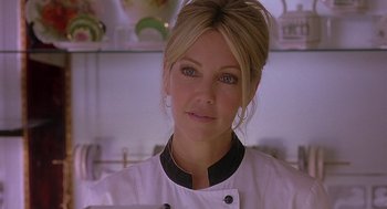 Movie still from “The Perfect Man” (2005), directed by Mark Rosman – A person wearing a chef's outfit; Close Up shot, Over the shoulder angle