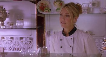 Movie still from “The Perfect Man” (2005), directed by Mark Rosman – A woman in a chef's outfit in front of a counter; Close Up shot, Over the shoulder angle