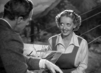 Movie still from “The Petrified Forest” (1936), directed by Archie Mayo – A man and a woman are talking to each other; Medium shot, High angle