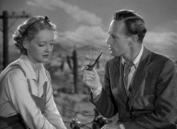 Movie still from “The Petrified Forest” (1936), directed by Archie Mayo – A man and a woman are talking to each other; Close Up shot, Low angle