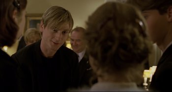 Movie still from “The Piano Teacher” (2001), directed by Michael Haneke – A person talking to another person; Close Up shot, Over the shoulder angle