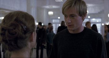 Movie still from “The Piano Teacher” (2001), directed by Michael Haneke – A man and a woman are talking in a room; Close Up shot, Over the shoulder angle