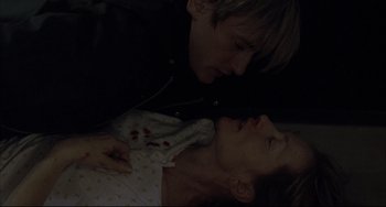 Movie still from “The Piano Teacher” (2001), directed by Michael Haneke – A couple of people that are in a room together; Close Up shot, Overhead angle