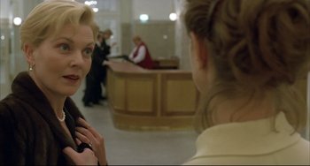 Movie still from “The Piano Teacher” (2001), directed by Michael Haneke – Two women are talking to each other in a lobby; Close Up shot, Over the shoulder angle