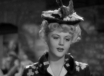 Movie still from “The Picture of Dorian Gray” (1945), directed by Albert Lewin – A black and white photo of a woman wearing a hat; Close Up shot, Over the shoulder angle
