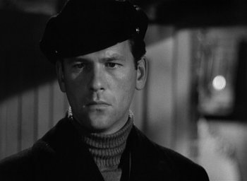 Movie still from “The Picture of Dorian Gray” (1945), directed by Albert Lewin – A black and white photo of a man wearing a hat; Close Up shot, Low angle