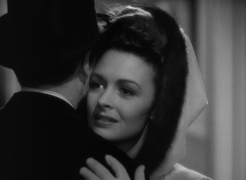 Movie still from “The Picture of Dorian Gray” (1945), directed by Albert Lewin – A man and a woman embracing each other in a black and white photo; Close Up shot, Over the shoulder angle