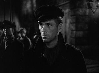 Movie still from “The Picture of Dorian Gray” (1945), directed by Albert Lewin – A black and white photo of a man wearing a hat; Close Up shot, Low angle