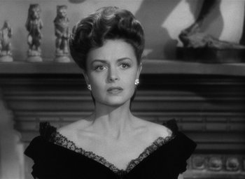 Movie still from “The Picture of Dorian Gray” (1945), directed by Albert Lewin – A black and white photo of a woman in a dress; Close Up shot, Over the shoulder angle