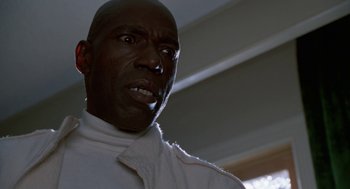 Movie still from “The Players Club” (1998), directed by Ice Cube – A person wearing a white shirt; Close Up shot, Low angle