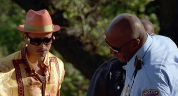 Movie still from “The Players Club” (1998), directed by Ice Cube – A man and a woman talking to each other outside; Close Up shot, Over the shoulder angle