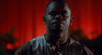 Movie still from “The Players Club” (1998), directed by Ice Cube – A person wearing a necklace; Close Up shot, Low angle