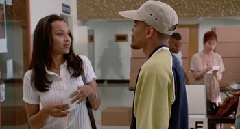 Movie still from “The Players Club” (1998), directed by Ice Cube – A man and a woman talking to each other; Medium shot, Over the shoulder angle